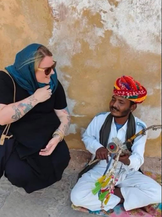 Chris with a street musician in Jaipur
