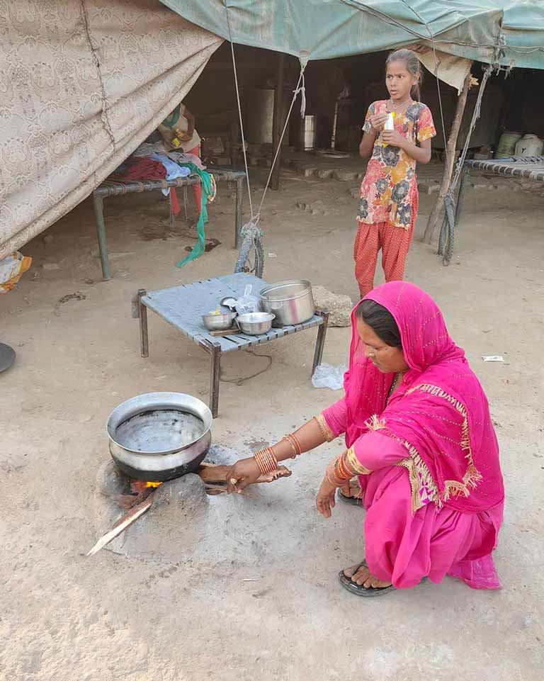 another villager cooks a meal