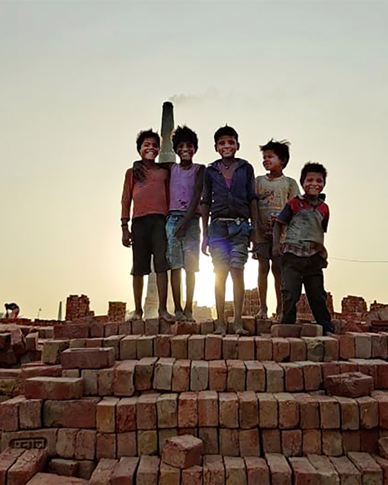 smiling kids in the brickmaking slum